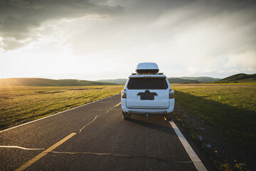 Car road trip on the high altitude mountain trail, China