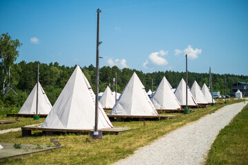 White tents in field ready for event