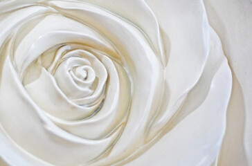 abstract light background of the core of a rose flower molded from clay. interior decoration