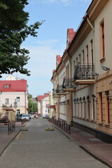 Fototapeta na wymiar Street with beautiful houses in the city of Grodno. Belarus.July 13, 2023