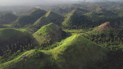 Mountains landscape aerial: building on top of mount with hiking path. Majestic Asia wild nature...