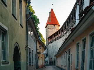 Fototapeta na wymiar Tallinn, Estonia - 07 01 2023: City wall and tower of the old city of Tallinn. Authentic European city