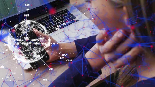 Animation of network of icons over caucasian businesswoman using smartphone and laptop