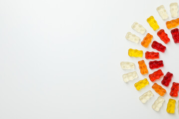 Gummy bears on white background, space for text