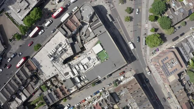Aerial spins looking straight down onto building roof top in London UK
