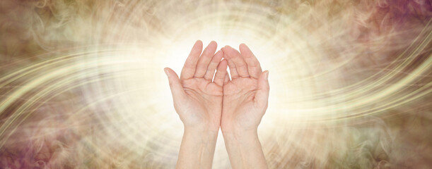 Sensing Golden Healing Life Force Energy Healing Vibes  - female open hand facing outwards against...