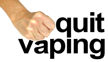 For your health's sake it is time to quit vaping - female hand in strong fist stamping down on the word VAPING isolated on a white  background
