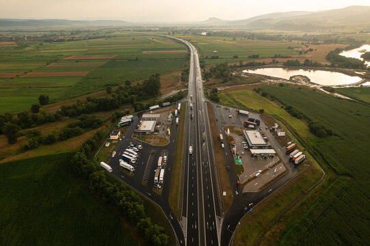Sebes, Romania - 5 July 2023: Aerial photo over A1 highway road in Romania and the Rompetrol gas stations next to Hunedoara and Sebes. Parking service and gas stations on highway.