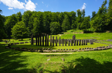 Sarmizegetusa Regia historical landmark in Romania. Wide angle photo during a sunny day in the middle of green forest Orastiei Mountains. Landmarks of Romania.