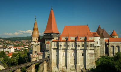 Corvin (Hunyad) Castle in Hunedoara against blue sky during a sunny day in Transylvania. Wide angle...