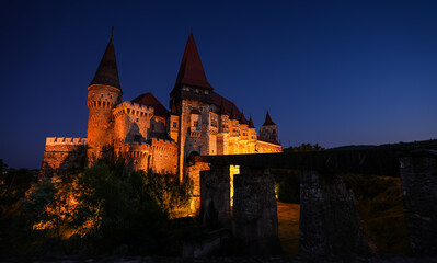 Fototapeta na wymiar Corvin (Hunyad) Castle in Hunedoara during the evening. Wide angle night phoot with this amazing medieval castle landmark in Romania.
