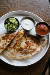 Traditional chicken quesadilla with sauces