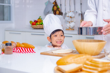 father and son cooking