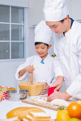 father and son cooking