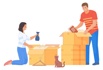 Man and woman packing things in cardboard boxes. Couple moving house