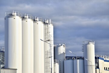  a modern dairy plant against a stormy sky.