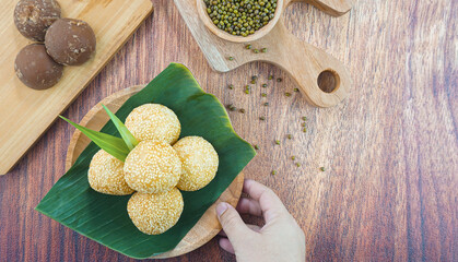Sesame seed balls or onde onde is a traditional food from Indonesia made of glutinous rice flour green beans sesame seeds brown sugar served in a plate