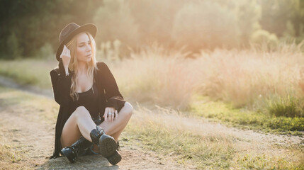 Sexy Girl in American country style, suede leather boho jacket and shorts, cowgirl style at nature