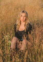 Sexy Girl in American country style, suede leather boho jacket and shorts, cowgirl style at nature