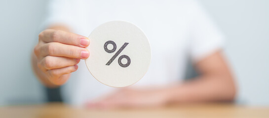 Woman show percentage symbol paper. Interest rate, financial, ranking, discount and promotion and...