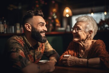 An old woman grandmother and her adult grandson sitting together at a cozy cafe, sharing laughter and conversation over a cup of coffee. Generative AI