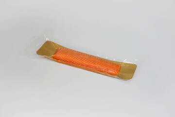 Packaged smoked salmon on white background
