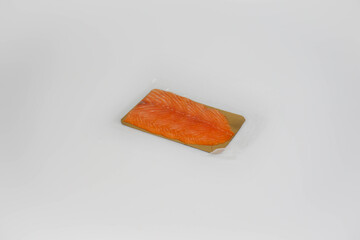 Packaged smoked salmon on white background