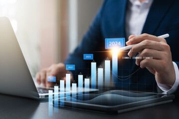 businessman new year business goals 2024, positive indicators 2024, company competitiveness on...