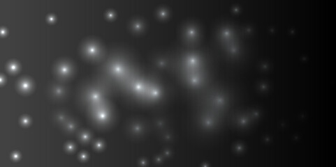 Abstract white light bokeh on black background. Holiday concept and celebration background. Defocused bokeh blur lights background. Festive bokeh light background.