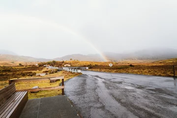 Fotobehang Cradle Mountain Rainbow across road at Ronny Creek in Cradle Mountain, Tasmania, Australia