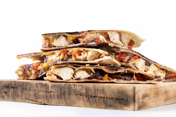 Mexican chicken quesadillas with cheese and peppers isolated on white background