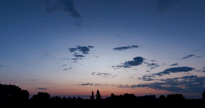 Time lapse of morning clouds at sunrise