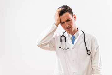 Image of worried and tired doctor thinking.	