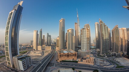 Aerial view of Dubai Downtown skyline with many towers day to night timelapse.