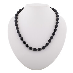 Dark mineral necklace on a white mannequin