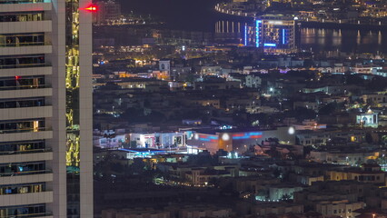 Fototapeta na wymiar Aerial view of apartment houses and villas in Dubai city near downtown night timelapse.