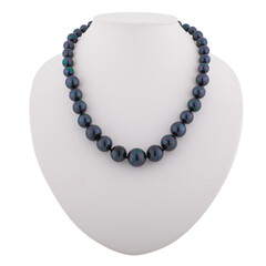 Dark mineral necklace on a white mannequin