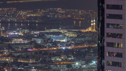 Fototapeta na wymiar Aerial view of apartment houses and villas in Dubai city near downtown night timelapse.