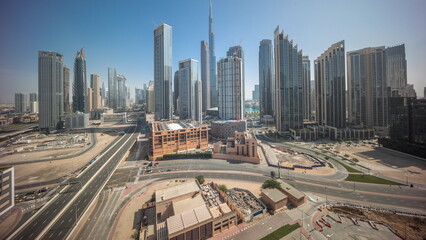 Naklejka na ściany i meble Aerial view of Dubai Downtown skyline with many towers all day timelapse.