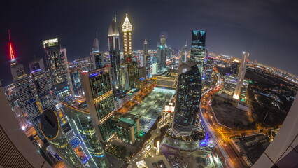 Skyline panorama of the high-rise buildings on Sheikh Zayed Road in Dubai aerial all night...