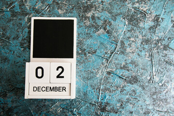 Wooden calendar on a dark background. International Day of Struggle for the Abolition of Slavery