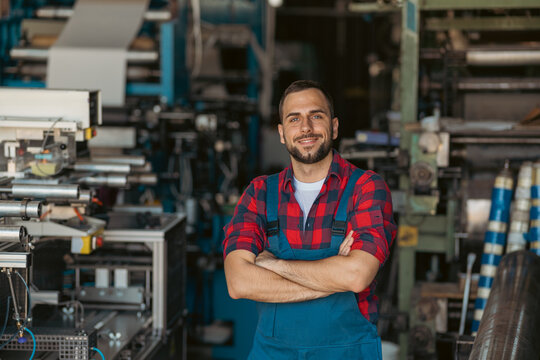 Young male welder standing strong facing the camera