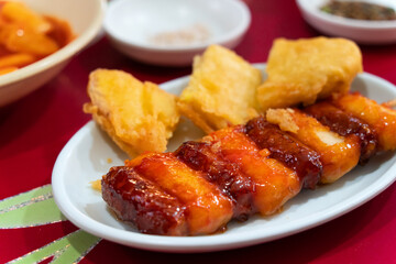 Delicious Korean cuisine Tteokbokki, spicy rice cake in market, street food.
