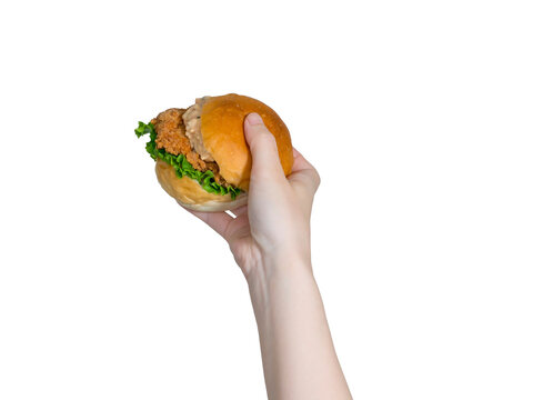 手に持ったハンバーガー