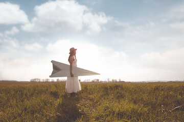 surreal woman carrying a giant paper airplane, abstract concept