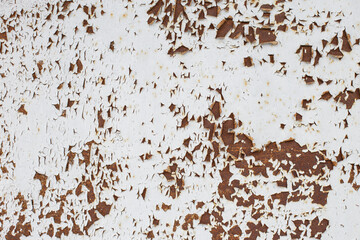 Rusty metal abstract background. Texture of an old grunge metal plate with cracked paint.