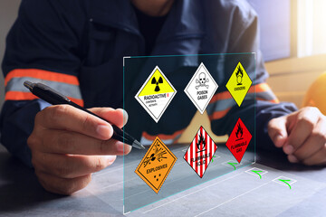 The warehouse safety officer inspects the check list of hazardous chemicals dangerous to meet safety standards before transport or distributed to industrial plants or export to foreign countries. - obrazy, fototapety, plakaty