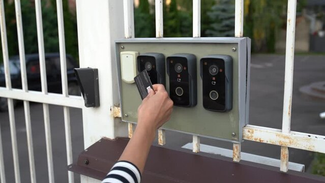 Proximity card reader door unlock, Hand security man using ID card on fingerprint scanning access control system for identity verification to open the door or for security safety or check attendance