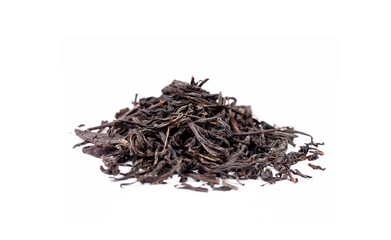 Dried black tea on the white background