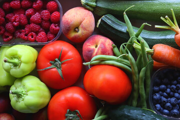 Wooden crate full of healthy colorful seasonal fruit and vegetable. Top view.